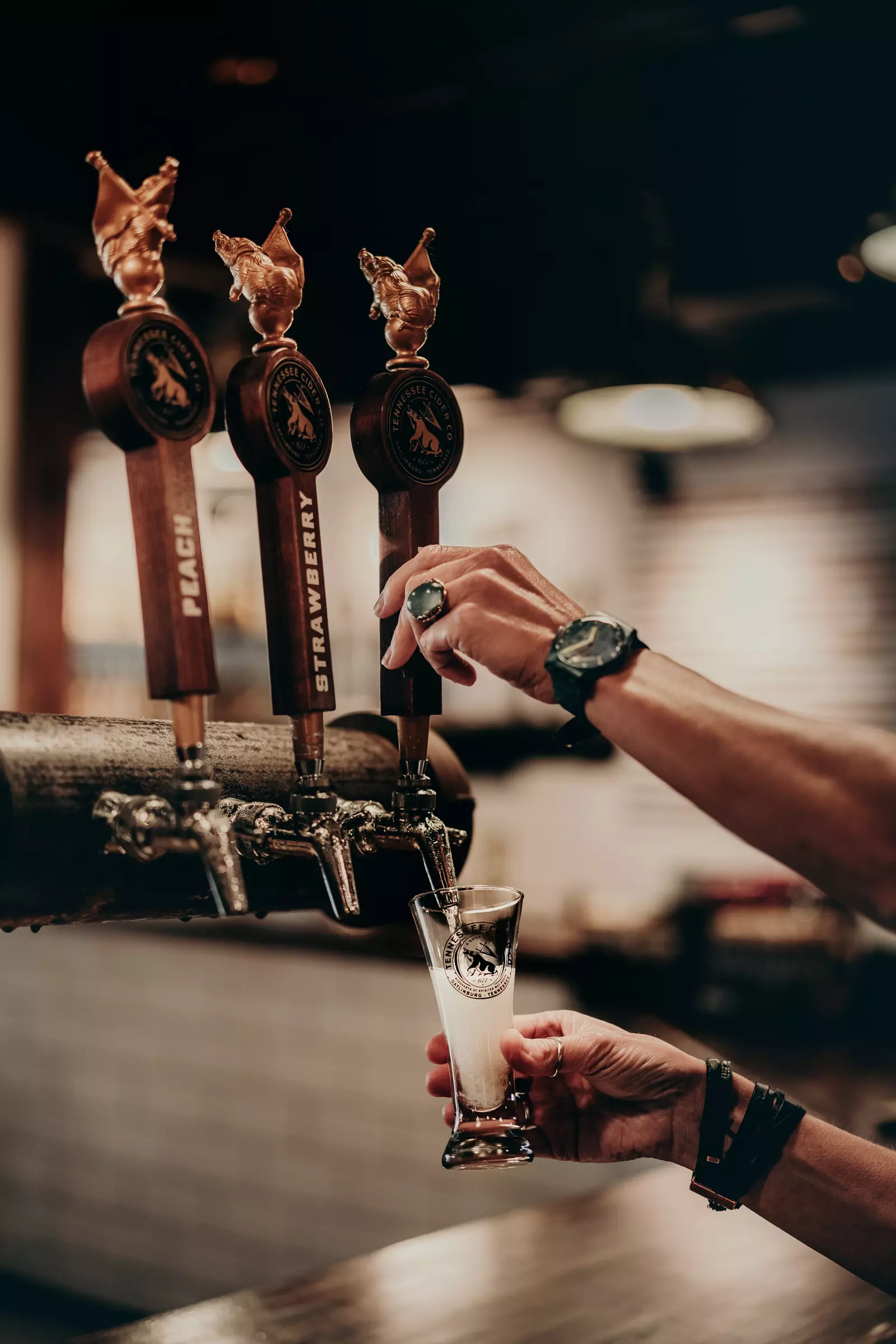 pouring cider from tap