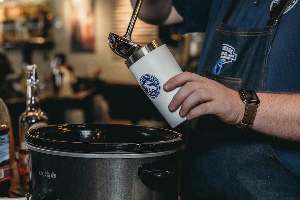 pouring mulled cider