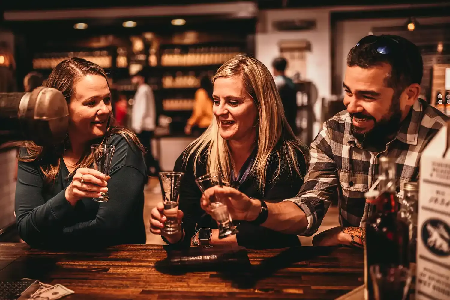 Friends enjoying free sips at Tennessee Cider Company in Gatlinburg, Tennessee