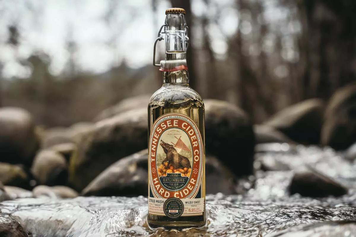 tn cider company bottle in river